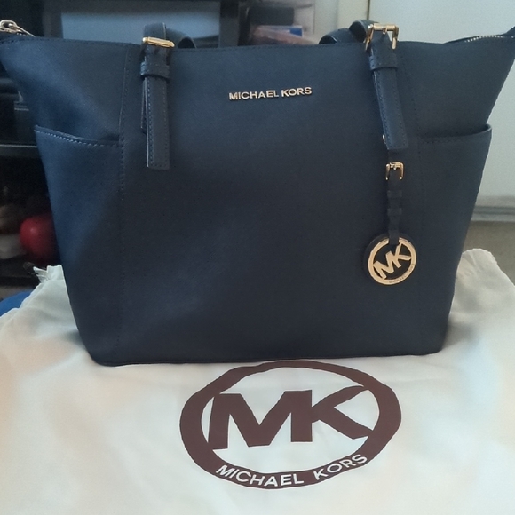 Michael Kors Handbags - Authentic Michael Kors Dark Blue Tote with Gold Accents Asking Price $70